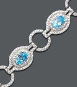 Icy ovals and glittering gemstones link up for a dazzling effect. Bracelet crafted in sterling silver features oval-cut blue topaz (4-3/4 ct. t.w.) and diamond accents. Approximate length: 7 inches.