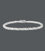 Exemplify elegance. This stunning tennis bracelet by B. Brilliant highlights sparkling, marquise-cut cubic zirconias (7-1/5 ct. t.w.) set in sterling silver. Approximate length: 7-1/4 inches.