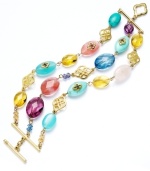 Amp up your look with a vibrant accessory. Lauren by Ralph Lauren's multicolored three-row bracelet highlights reconstituted semi-precious turquoise and glass beads. Set in gold tone mixed metal. Approximate length: 7-1/2 inches.