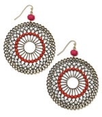 Add a little embellishment to your classic collection. INC International Concepts pretties up intricate filigree detail with coral plastic stones and pink crystal accents on these distressed brass oxidized-plated circle earrings. Crafted in mixed metal. Approximate drop: 2-3/4 inches.