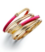 Covet the colorblock. INC International Concepts' trendy 5 bangle set combines smooth and sandblasted 12k gold-plated bangles with wrapped fuchsia-colored nylon thread. Approximate diameter: 2-1/2 inches.