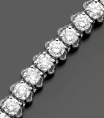 Elevate elegance with a seemingly endless display of diamonds. This beautiful diamond bracelet features round-cut diamonds (6 ct. t.w.) set in 14k white gold. 6 carat diamond bracelet approximate length: 7 inches.