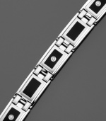 This geometric bracelet is comprised of smooth, stunning sterling silver squares accented with black enamel and highlighted with a few found-cut diamonds (1/8 ct. t.w.) Approximate length: 8 inches.