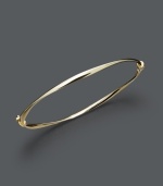 Add a luxurious layer for simple refinement. Bangle features a subtle twist design crafted in 14k gold. Approximate diameter: 2-3/8 inches.