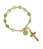 Get faith-inspired style with rosary-themed jewelry by Vatican. Bracelet features a gold tone mixed metal chain, charm, and cross accented by plastic olivine beads. Approximate length: 6-1/2 inches. Approximate charm drop: 1-3/4 inches.