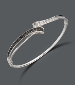 Let all the elements of style come together in this chic, contrasting bangle. Sterling silver bracelet features round-cut black diamonds (1/6 ct. t.w.) and white diamonds (1-1/10 ct. t.w.). Approximate diameter: 2-1/2 inches.