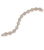 Glittering glass crystals in a distinctive oval shape adorn this elegant bracelet from Carolee. It's sure to add glamour to your workday wardrobe and dress up your ensemble for a special occasion. Made in gold tone mixed metal. Approximate length: 7 inches.