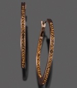 A soft, eye-catching hue adds originality and intrigue to these gorgeous earrings by Fossil. Featuring crystal accents set in brown ion-plated mixed metal. Approximate diameter: 1-1/4 inches.