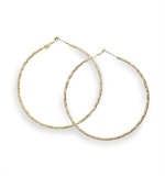 Go for the gold! Crafted in gold tone mixed metal, Alfani's classic hoop earrings get a design update with a stylish textured surface. Approximate diameter: 2-1/4 inches.