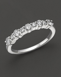 Diamond band in 14K white gold.