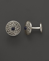 Intricate sterling silver cuff links, accented with black onyx. By Buccellati.