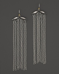 Silver and gold mingle with a dramatic fall of chains. By Gurhan.