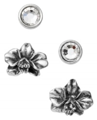 Petite and precocious. Fossil's stud earrings set features a pair of intricate orchids and round-cut clear crystals in a bezel setting. Crafted in vintage silver tone mixed metal. Approximate diameters: 1/4 inch and 5/8 inch.