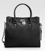 Beautifully tailored and versatile design of rich leather, finished with double top handles and a shoulder strap.Double top handles, 5 drop Chain and leather shoulder strap, 12 drop Magnetic snap closure Protective metal feet One inside zip pocket Four inside open pockets Fully lined 14W X 13H X 5½D Imported