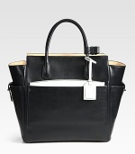 Function and luxury combine in this top-handle carryall, crafted from glovetan leather. Double top handles, 5 dropFour outside open pocketsProtective metal feetTwo inside zip pocketsInner zip pouchCotton lining18W X 13¾H X 5½DImported