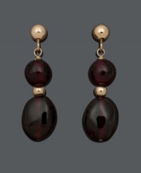 Get a double dose of style in rich, red hues. These daring drops feature two, graduated (6 mm and 6 mm x 8 mm), garnet beads (14 ct. t.w.) in a 14k gold post setting. Approximate drop: 3/4 inch.