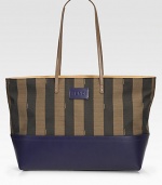 Boldly striped canvas pairs with luxe calfskin leather in this roomy outing essential.Shoulder straps, 10 drop Top zip closure Linen lining 15W X 12H X 5D Made in Italy