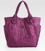 EXCLUSIVELY AT SAKS in Royal Purple. Signature letter stitching defines this roomy carryall, finished with oversized pockets and elegantly knotted handles.Double top handles, 8 dropMagnetic top closureTwo outside open pocketsOne inside zip pocketTwo inside open pocketsFully lined20W X 15H X 5½DImported Please note: Hardware varies by bag. 