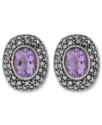 Perfect your look with polished studs. Genevieve & Grace's oval-shaped earrings feature amethyst centers (3-5/8 ct. t.w.) surrounded by glittering marcasite. Set in sterling silver. Earrings feature an omega clip-on backing for non-pierced ears. Approximate length: 3/4 inch. Approximate width: 5/8 inch.