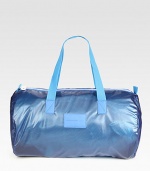 Hit the gym, or just look like it, with this athletic-inspired duffel crafted in versatile, packable polyester.Zip closureTop handles98% polyester/2% pvc22W x 11¾H x 11½DImported