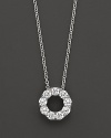 A lovely diamond circle pendant necklace in diamond and 14 Kt. white gold.