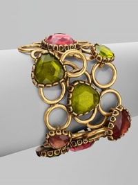 An unique style with brightly colored, hand-poured resin cabochons set atop a fused open ring bracelet. Resin stonesBrass and pewterLength, about 7½Toggle closureMade in USA