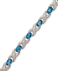 The perfect gift. Both symbolic and stylish, this XO tennis bracelet features oval-cut London blue topaz (7-1/2 ct. t.w.) and sparkling diamond accents in sterling silver. Approximate length: 7 inches.