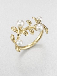 A floral piece in 18k gold and lustrous cultured pearls. 3.75mm-4.75mm round white cultured pearls18k goldImported 