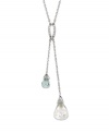 Double up on stylish sophistication with Swarovski's crystal drop pendant. Necklace crafted in silver tone mixed metal with clear and blue drops. Approximate length: 14 inches. Approximate drop: 2-1/2 inches.