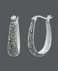 Free-spirited style with bohemian savvy. Genevieve & Grace hoop earrings feature glittering marcasite scrolls set in sterling silver. Approximate diameter: 15/16 inch.