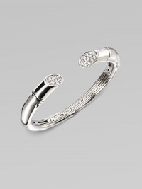 A sizable cuff accented with white sapphires adorned ends. White sapphires Sterling silver Kick mechanism closure Diameter, about 2¼ Imported 