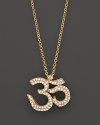 Diamonds set in 14K yellow gold ohm pendant.