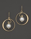 Gleaming freshwater pearls shine from the heart of 14K. yellow gold swirls.