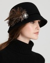 Aqua gives this cloche vintage charm with a crystal-and-pearl brooch, black velvet trim and feathers.