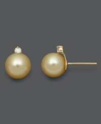 Embrace timeless beauty with simple studs. These south sea pearls (8-9 mm) boast a rich, golden color with round-cut diamond (1 ct. t.w.) for an extra hint of sparkle. Earrings crafted in 14k gold. Approximate diameter: 1/3 inch.