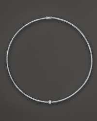 A single diamond station shines on this 18K white gold mesh necklace from Roberto Coin.