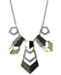 Industrial-strength fashion. This bib-style necklace from GUESS adds intrigue with both smooth and hammered pieces embellished with crystal accents. Crafted in imitation rhodium, shiny gold tone and hematite tone mixed metal. Approximate length: 18 inches + 2-inch extender. Approximate drop: 3 inches.