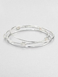 From the Rock Candy® Collection. A trio of hammered, sterling silver bangles accented with faceted mother-of-pearl. Sterling silverMother-of-pearlDiameter, about 2.5Slip-on styleImported 