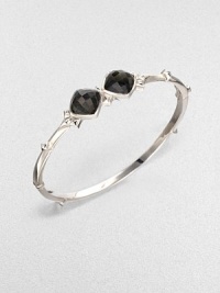 From the Superstud Collection. Two diamond-shaped faceted cushions of clear quartz layered over faux cat's eye create a dramatic look in a bangle of bright sterling silver dotted with pointy studs.Synthetic cat's eye and clear quartzRhodium-plated sterling silverDiameter, about 2.25Box-and-tongue claspImported