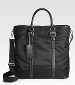 An everyday essential, handsomely crafted in tessuto nylon, trimmed with textured saffiano leather.Snap button closureDouble top handlesAdjustable shoulder strapInterior zip pocketNylon15W x 15H x 7DMade in Italy