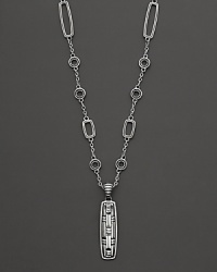 John Hardy's tribal-influenced station necklace features rectangle and circle stations and a carved pendant at the base.