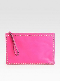 An edgy design with modern appeal in supple leather with pyramid stud details.Wristlet strap, 7 dropTop zip closureOne inside zip pocketTwo inside open pocketsCanvas lining13½W X 8¾H X ½DMade in Italy