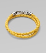 A handsomely braided leather bracelet with bold color and wrap-around styling. Leather About 3 diam. Spring clasp Made in Italy 