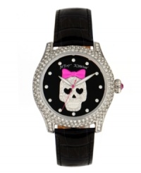 Cuteness to die for. Watch by Betsey Johnson crafted of black croc-embossed leather strap and round polished stainless steel case covered in crystal accents. Black dial features crystal accent markers, large silver tone skull with pink bow and crystal accents at center, silver tone hour and minute hands, signature fuchsia second hand and logo. Quartz movement. Water resistant to 30 meters. Two-year limited warranty.