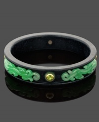 Diversify your style. This exotic bangle bracelet features a solid onyx setting (16-17 mm) with scrolls of intricate jade (5 mm), and a round-cut peridot (2-1/4 ct. t.w.) edged by 14k gold accents. Approximate diameter: 2-1/2 inches.