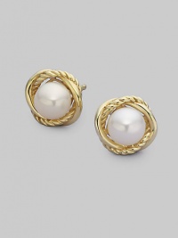 From the Infinity Collection. Two elegant, intertwined bands of 18k yellow gold surround an exquisite, naturally hued pearl. 6mm white pearls 18k yellow gold Diameter, about ½ Post back Imported