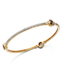 A slim row of sparkle makes a big impact. Victoria Townsend's pretty bangle bracelet slips over the wrist and shines in round-cut smokey quartz (3-9/10 ct. t.w.) with diamond accents. Set in 18k gold over sterling silver. Approximate length: 8 inches. Approximate diameter: 2-1/2 inches.