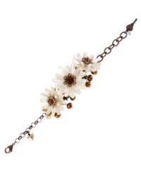 Beauty is in bloom. This bracelet from Betsey Johnson is crafted from brown gold-tone mixed metal with topaz-colored beads and crystals, as well as pearl-tone petals, adding a vibrant touch. Approximate length: 8 inches.