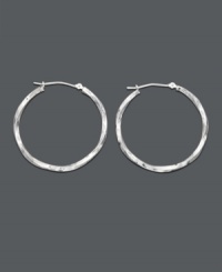 Elegant earrings with a chic twist. The perfect last minute accessory -  hoop earrings crafted in 14k white gold with a unique twisted design. Approximate diameter: 1-1/4 inches.