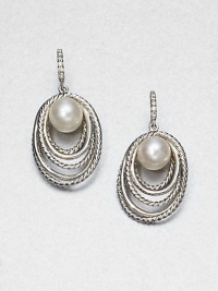 From the Pearl Crossover Collection. Round, lustrous pearls framed by iconic, sterling silver cable rings accented by dazzling diamonds. 8mm-8.5mm round white cultured pearlsSterling silverDiamonds, .09 tcwLever backImported 